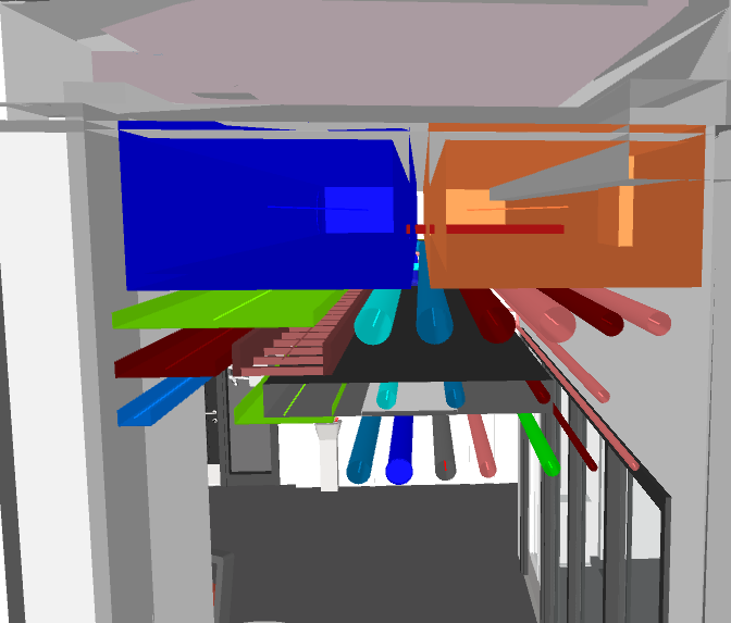 Hospital corridor ceiling void before MEP BIM coordination — unresolved HVAC ductwork and pipe clashes